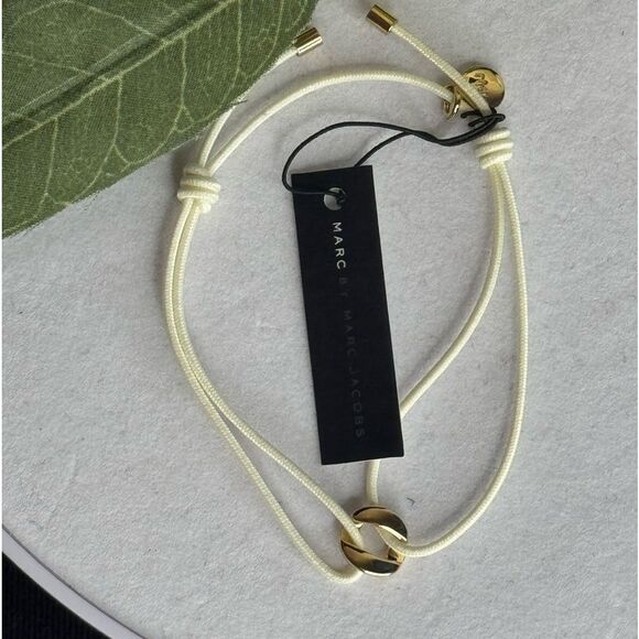 Marc By Marc Jacobs Cream String Bracelet With Gold Tone TurnLock Charm - Picture 2 of 5